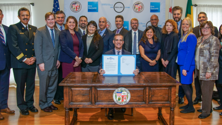 Mayor Eric Garcetti surrounded by City managers and representatives